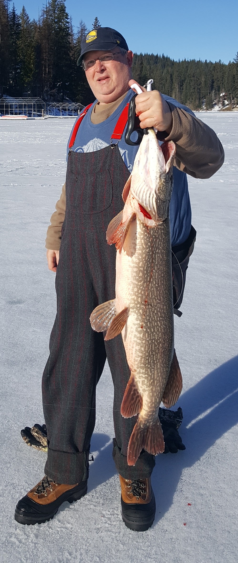 Pete Barnes with a 20-pound Hayden Lake northern pike caught through the ice using a herring.