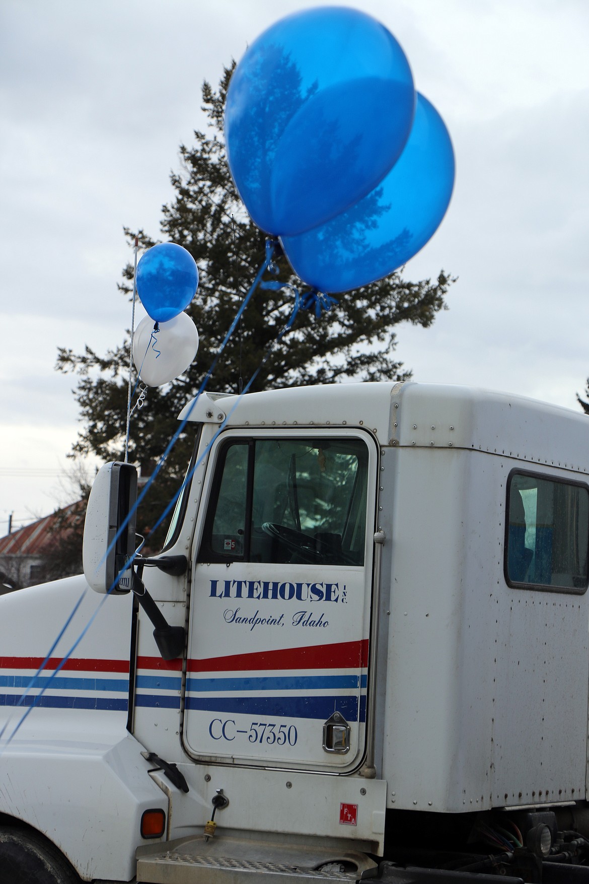 (Photo by CAROLINE LOBSINGER)Blue and white balloons adorn a Litehouse truck outside the company's newly expanded production facility on Ella Avenue.