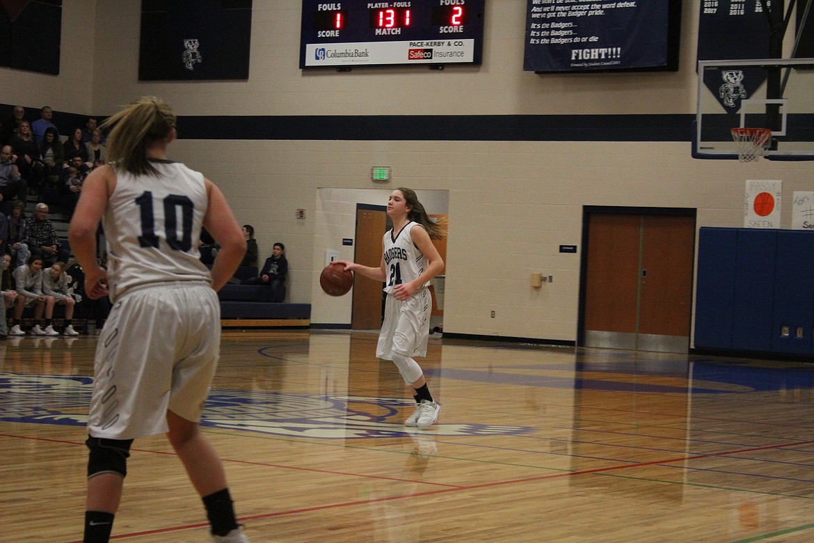 Photo by Tanna Yeoumans
Holly Ansley bringing the ball back to rival court with Kassy Skeen at the ready.