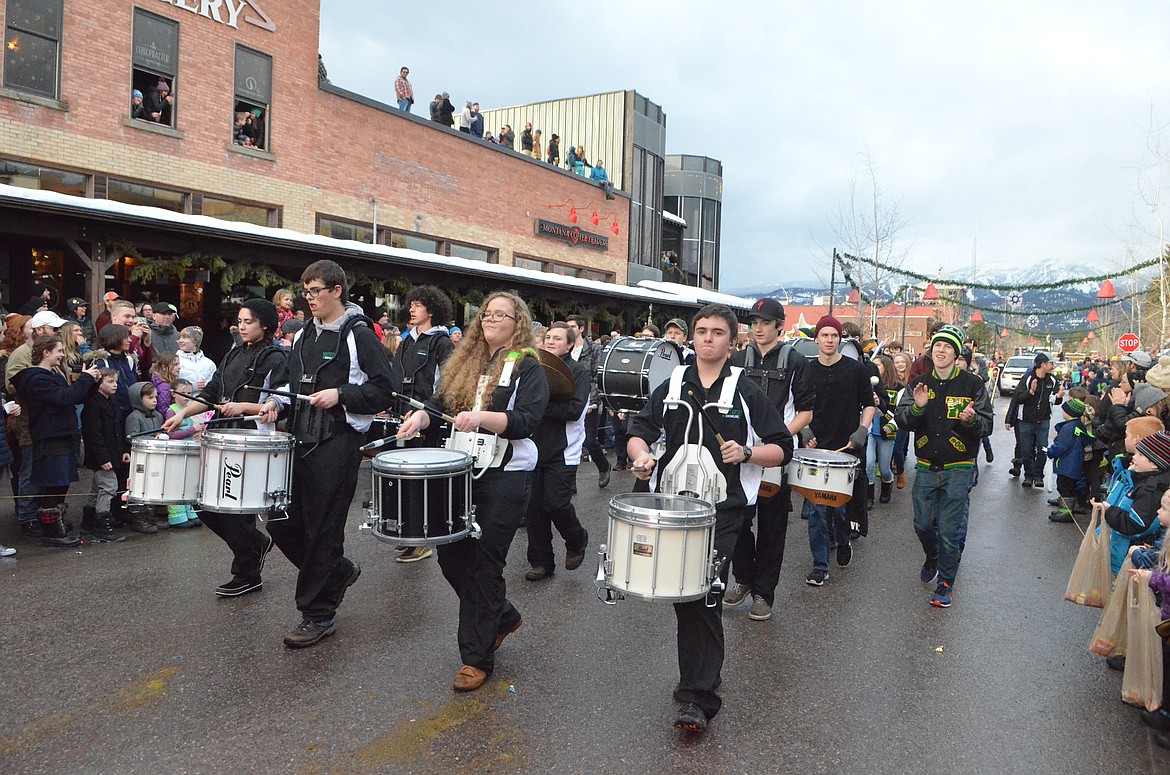 The Whitefish High School Drumline marches through downtown Whitefish during the Grand Parade. (Heidi Desch/Whitefish Pilot)