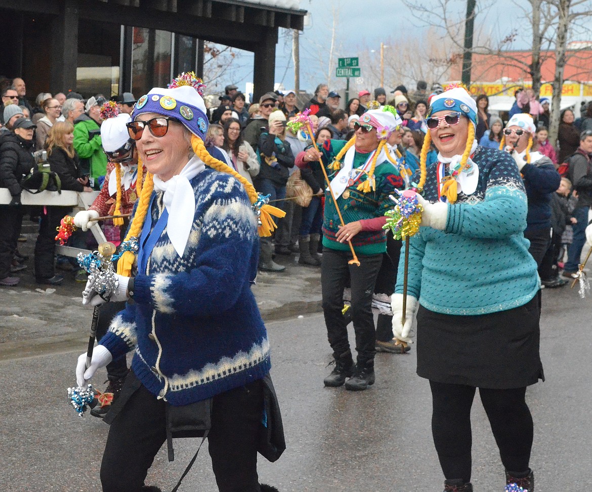 The Working Women of Whitefish dance down Central Avenue. (Heidi Desch/Whitefish Pilot)