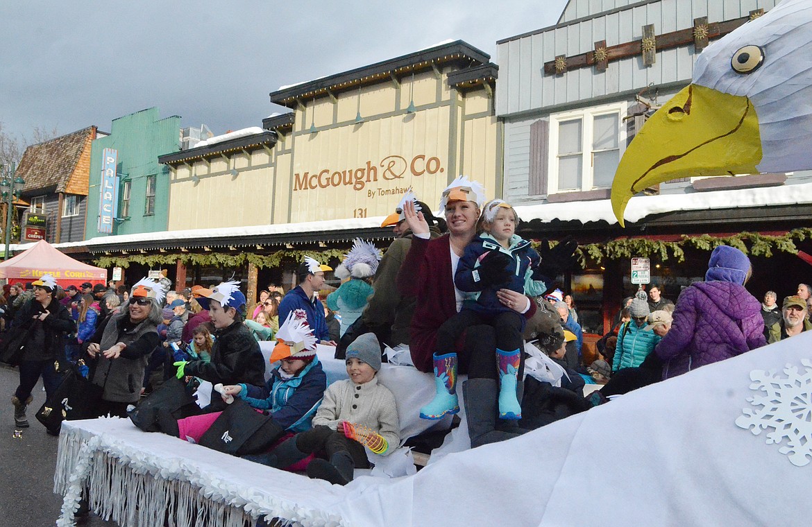 The Glacier Bank float travels Central Avenue. (Heidi Desch/Whitefish Pilot)