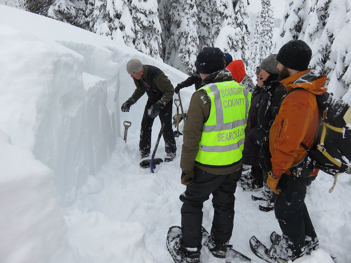 Jon Jeresek, a volunteer with David Thompson Search and Rescue, demonstrates methods for forecasting avalanche risk by digging a pit and testing the snowpack. (Courtesy photo)