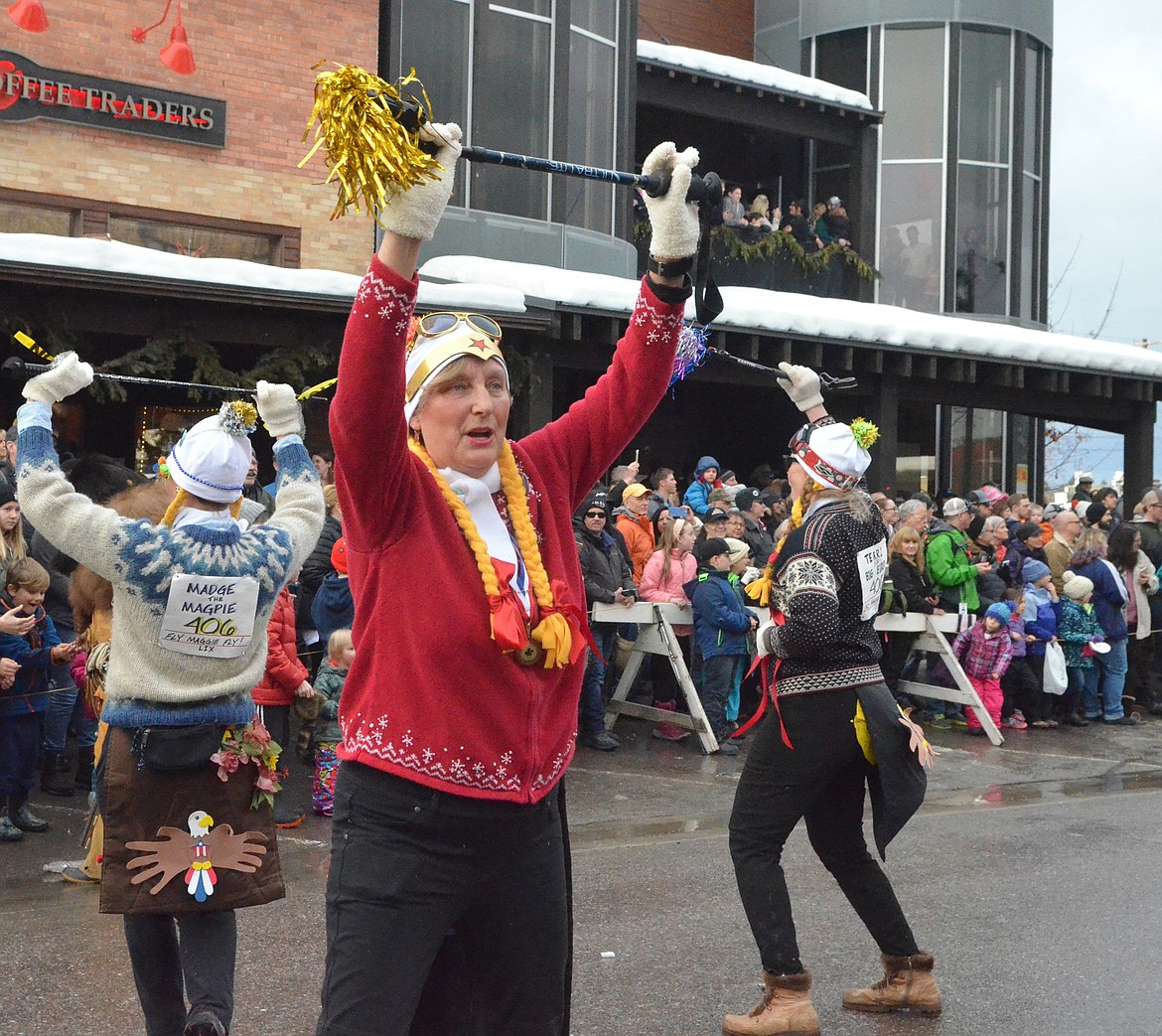 The Working Women of Whitefish dance down Central Avenue. (Heidi Desch/Whitefish Pilot)