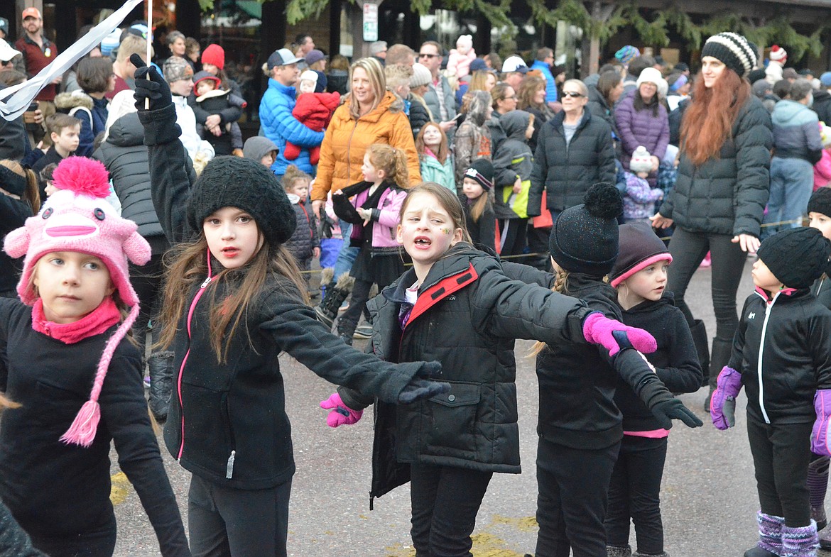 Whitefish Dance and Bigfork Dance members dance their way down Central Avenue. (Heidi Desch/Whitefish Pilot)