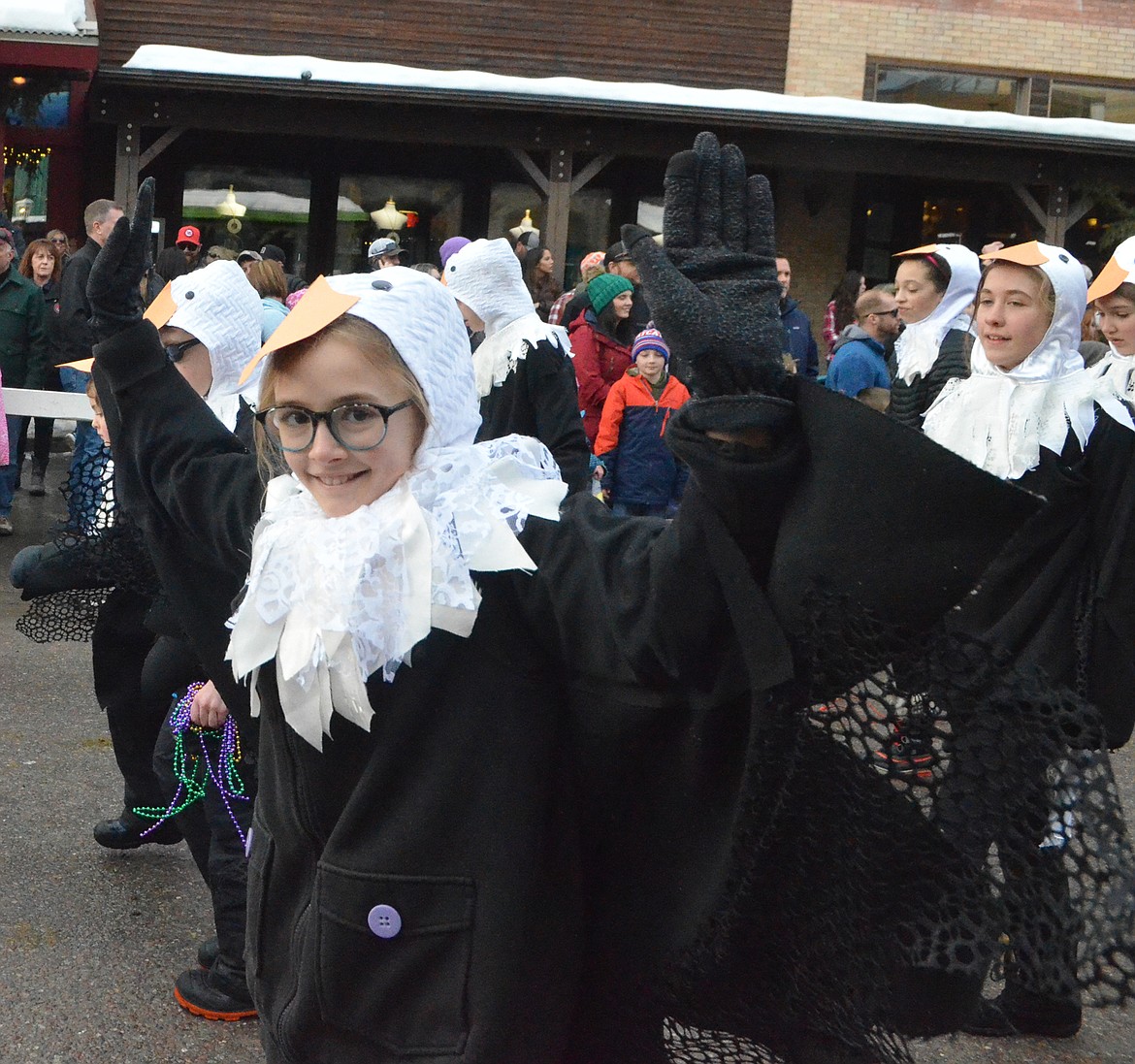 Whitefish Theater Co. eagles fly down Central Avenue during the Grand Parade. (Heidi Desch/Whitefish Pilot)