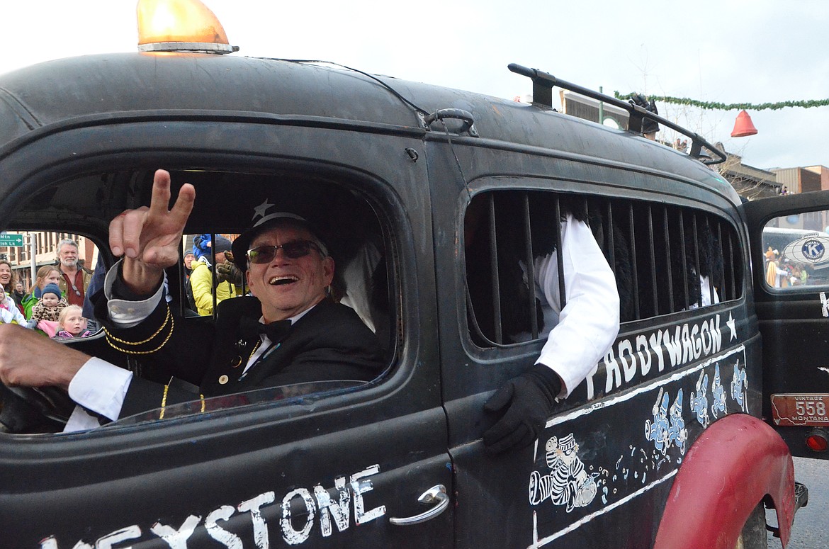 The Keystone Cops transport some Yetis in the Paddywagon down Central Avenue. (Heidi Desch/Whitefish Pilot)