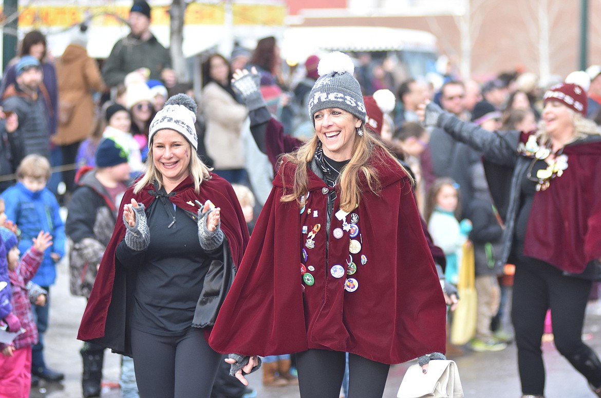 Linda Ray and Brenda Twete lead a group of former Duches of Lark through the parade Saturday. (Heidi Desch/Whitefish Pilot)