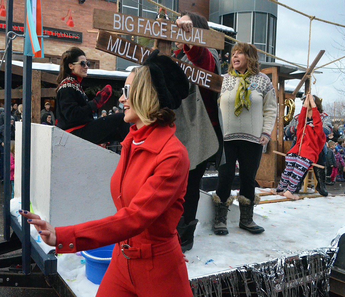 The Reecia's Salon float travels down Central Avenue during the Whitefish Winter Carnival Grand Parade. (Heidi Desch/Whitefish Pilot)