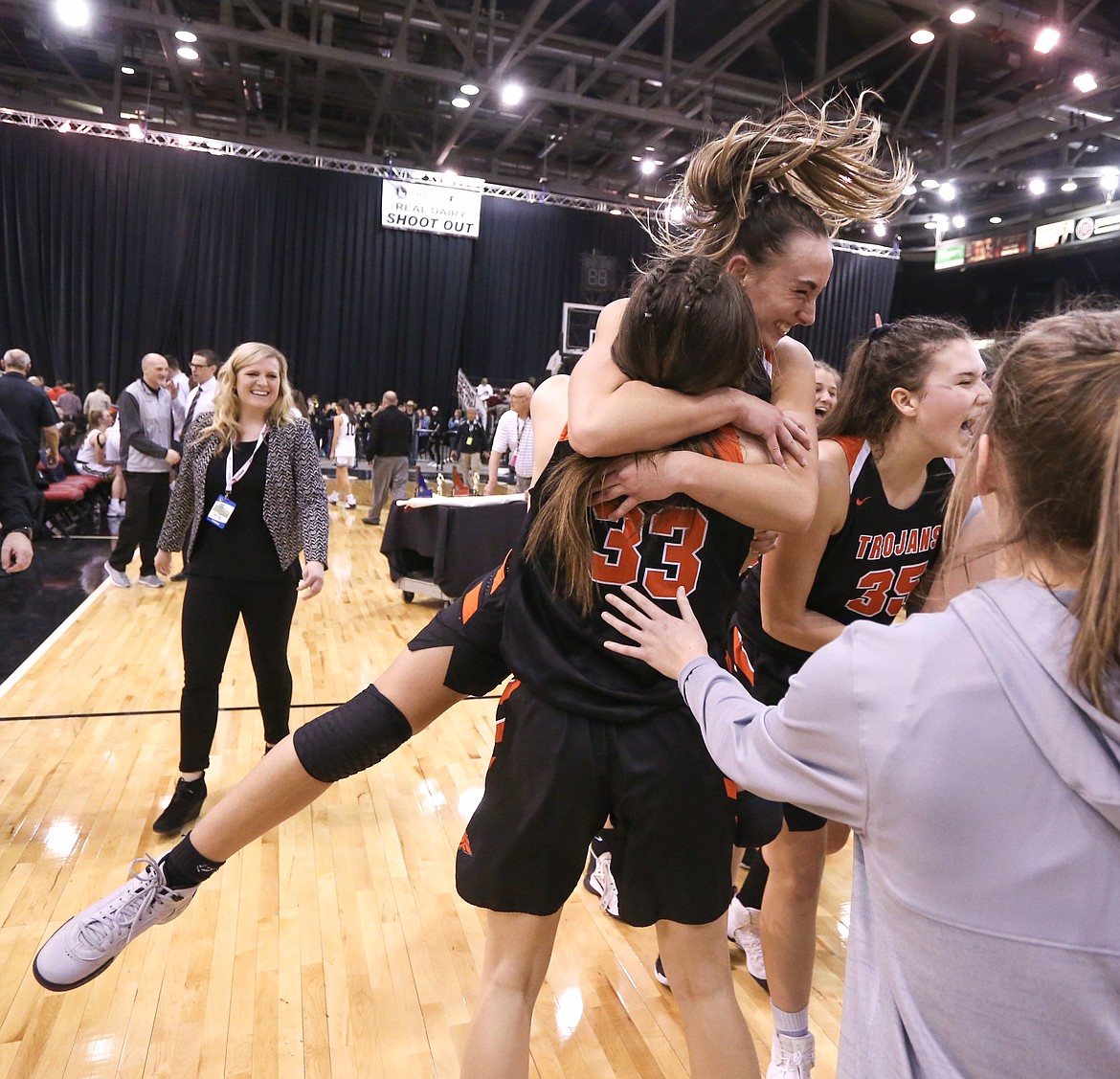 JASON DUCHOW PHOTOGRAPHY
Bayley Brennan leaps into the arms of Melody Kempton after Post Falls won the state 5A girls basketball title Saturday night at the Ford Idaho Center in Nampa.