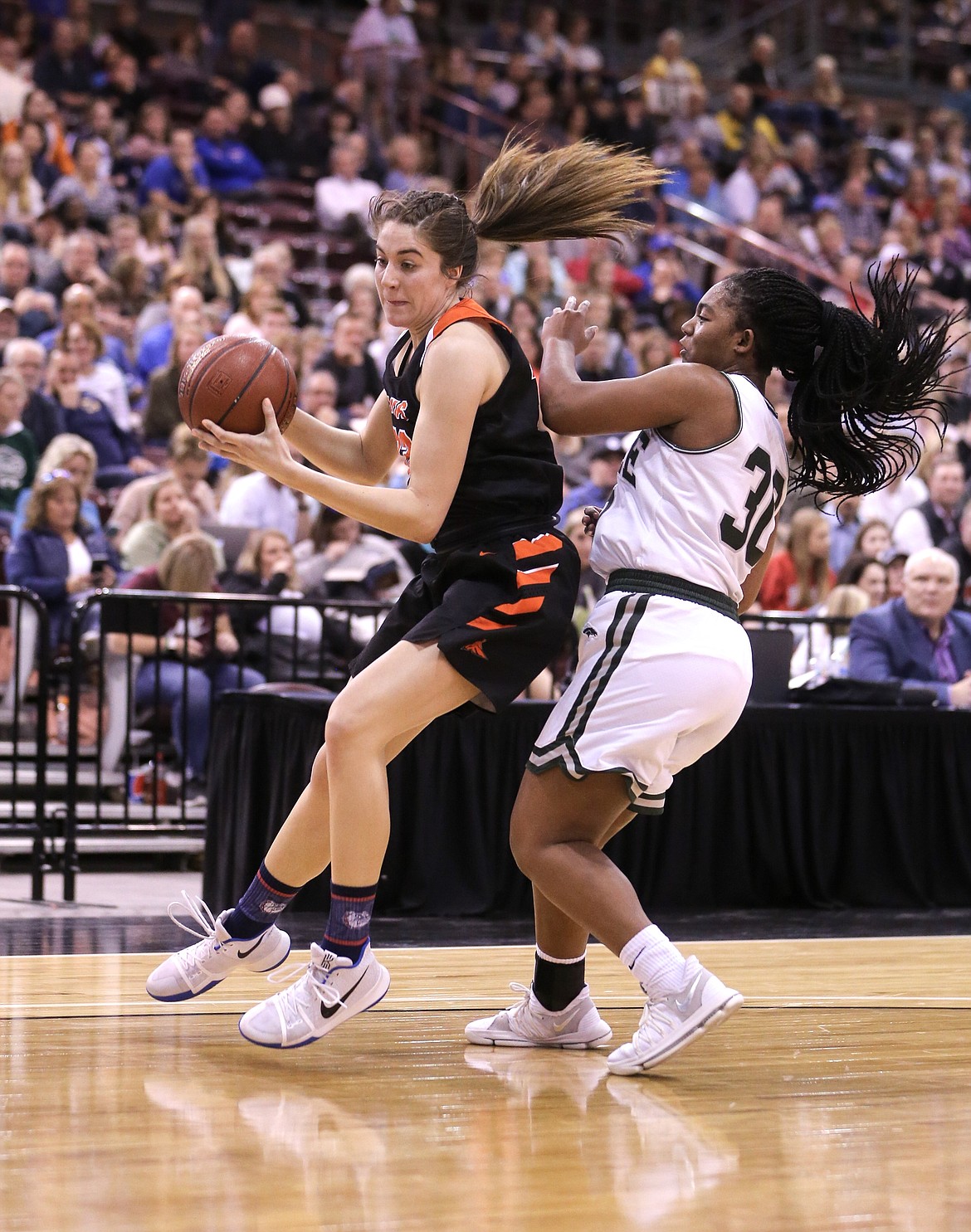 JASON DUCHOW PHOTOGRAPHY
Melody Kempton of Post Falls takes the ball to the basket against the defense of Jaimee McKinnie of Eagle during the state 5A championship game Saturday night at the Ford Idaho Center in Nampa.