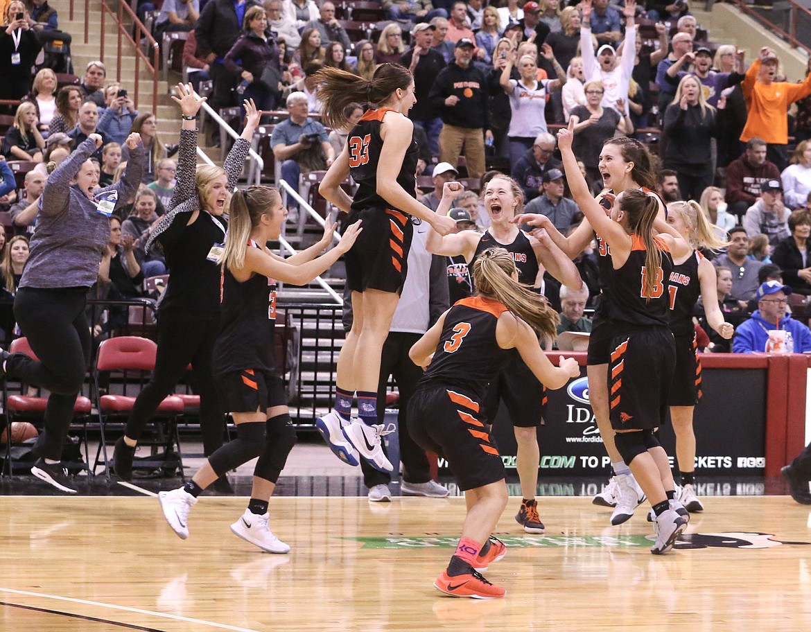 JASON DUCHOW PHOTOGRAPHY
Melody Kempton, center, leaps into the air as she and her Post Falls High teammates celebrate a 62-53 victory over Eagle in the state 5A girls basketball championship game Saturday night at the Ford Idaho Center in Nampa. Post Falls won its first state title since 2013, and fifth in program history.