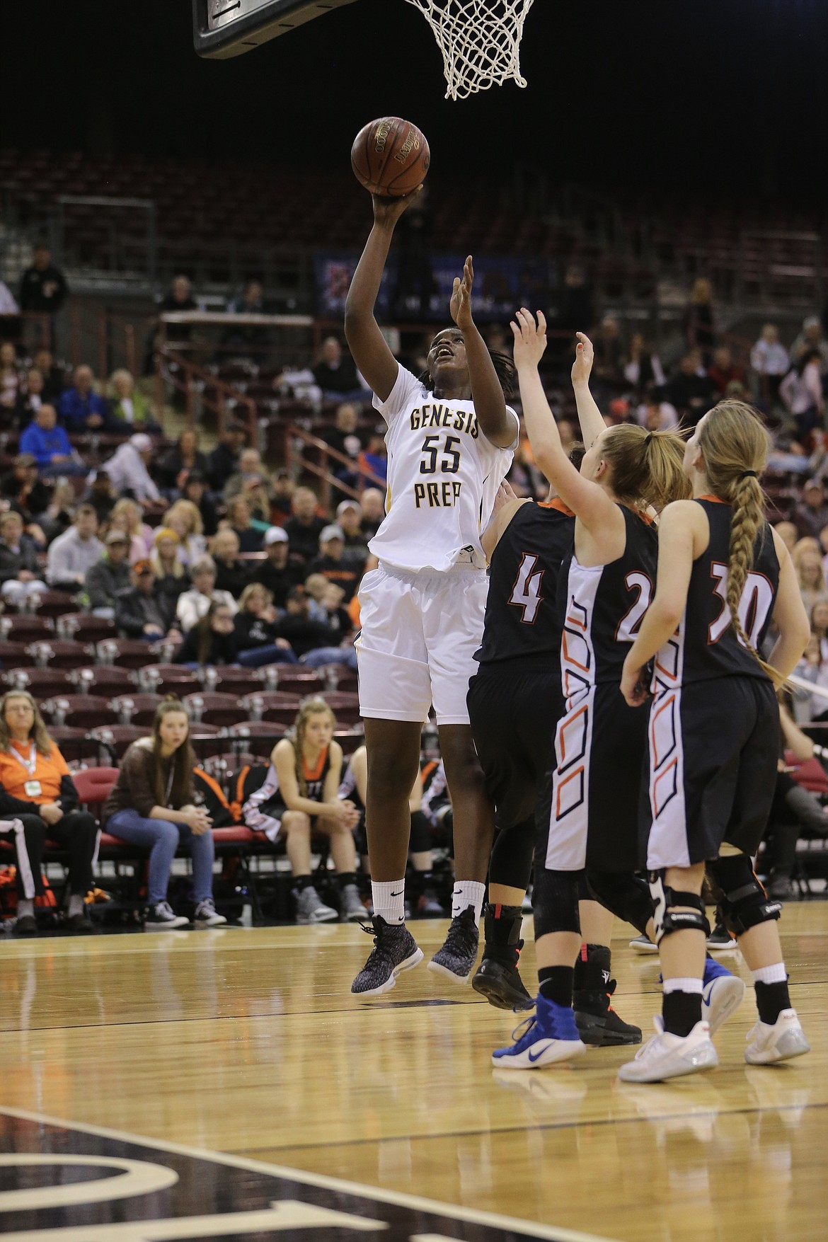 JASON DUCHOW PHOTOGRAPHY
Bella Murekatete of Genesis Prep goes up for a shot against Butte County in the state 1A Division II title game Saturday at the Ford Idaho Center in Nampa.