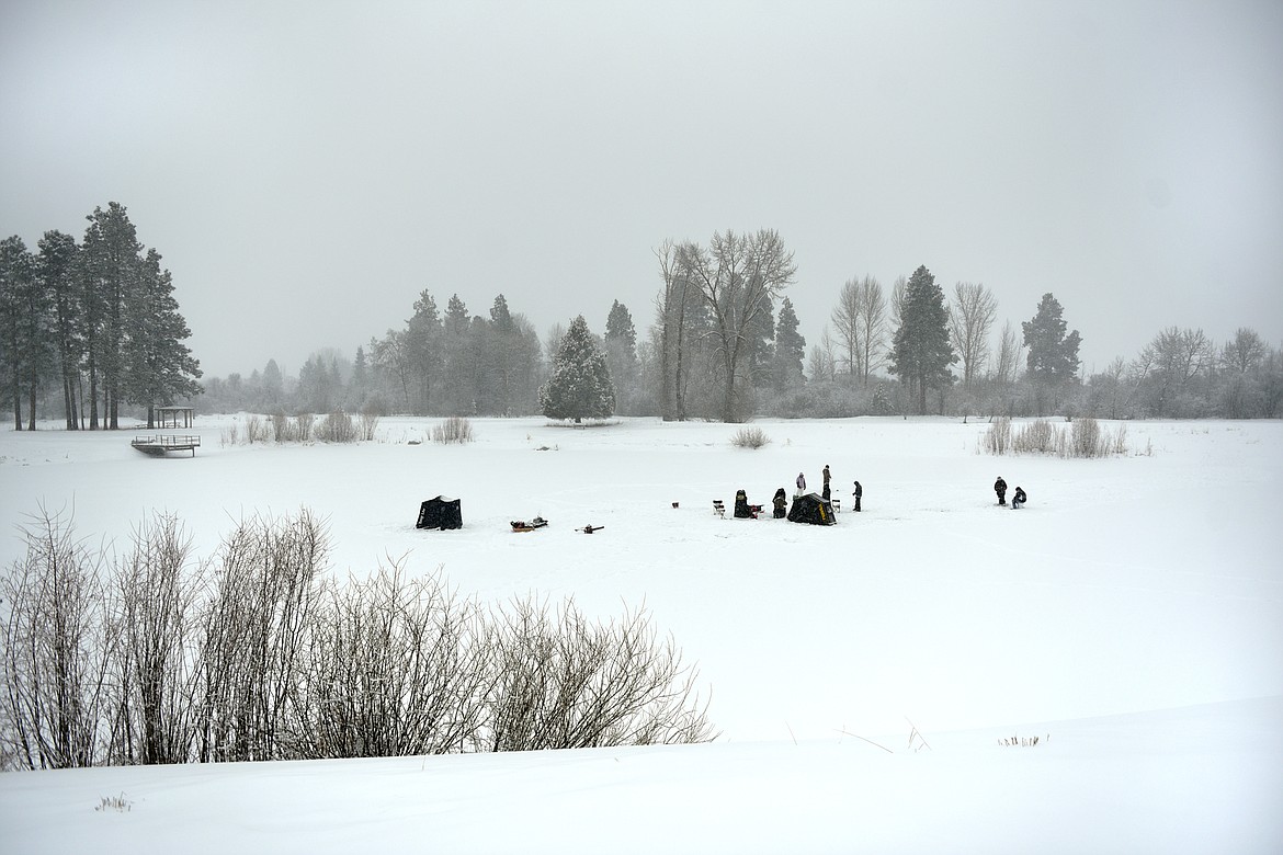 The Becoming an Outdoors-Woman ice fishing workshop at Pine Grove Pond on Saturday. (Casey Kreider/Daily Inter Lake)