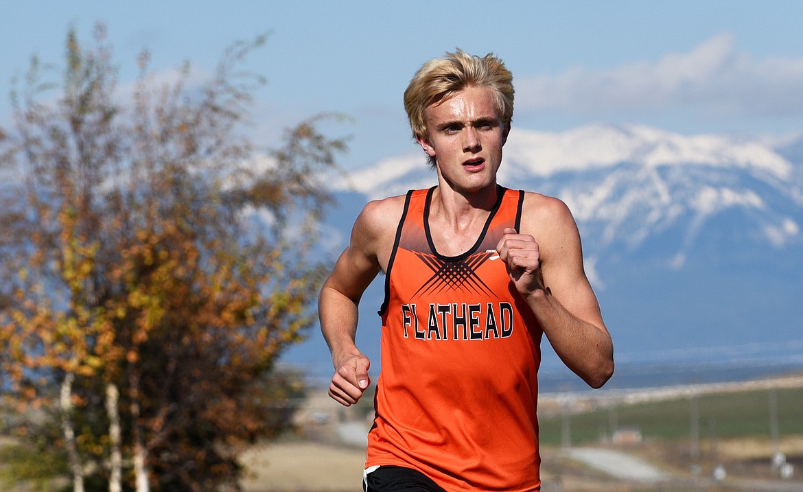 Flathead's Ben Perrin climbs a hill during the Glacier Invitational at Rebecca Farm on Wednesday. (Aaric Bryan/Daily Inter Lake)