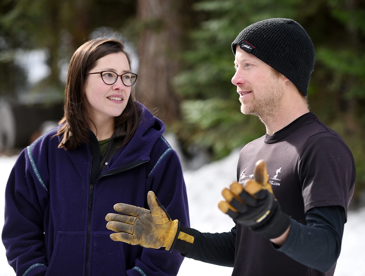 Samantha and Mark Schurke of Base Camp Bigfork chat with clients after a trail run on Friday, January 26.(Brenda Ahearn/Daily Inter Lake)