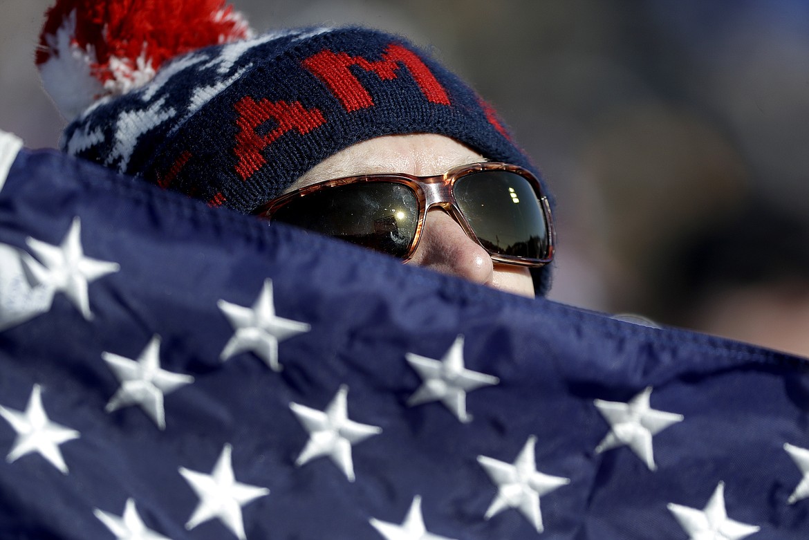 USA fan Dan Ness watches Maggie&#160;Voisin, of the United States, run the course during the women&#146;s slopestyle qualifying at Phoenix Snow Park at the 2018 Winter Olympics in Pyeongchang, South Korea, Saturday, Feb. 17, 2018. (AP Photo/Gregory Bull)