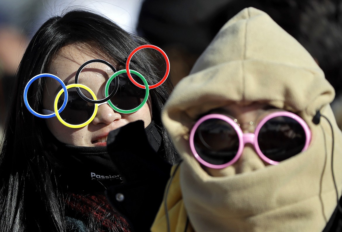 Fans watch the women&#146;s slopestyle qualifying at Phoenix Snow Park at the 2018 Winter Olympics in Pyeongchang, South Korea, Saturday, Feb. 17, 2018. (AP Photo/Gregory Bull)