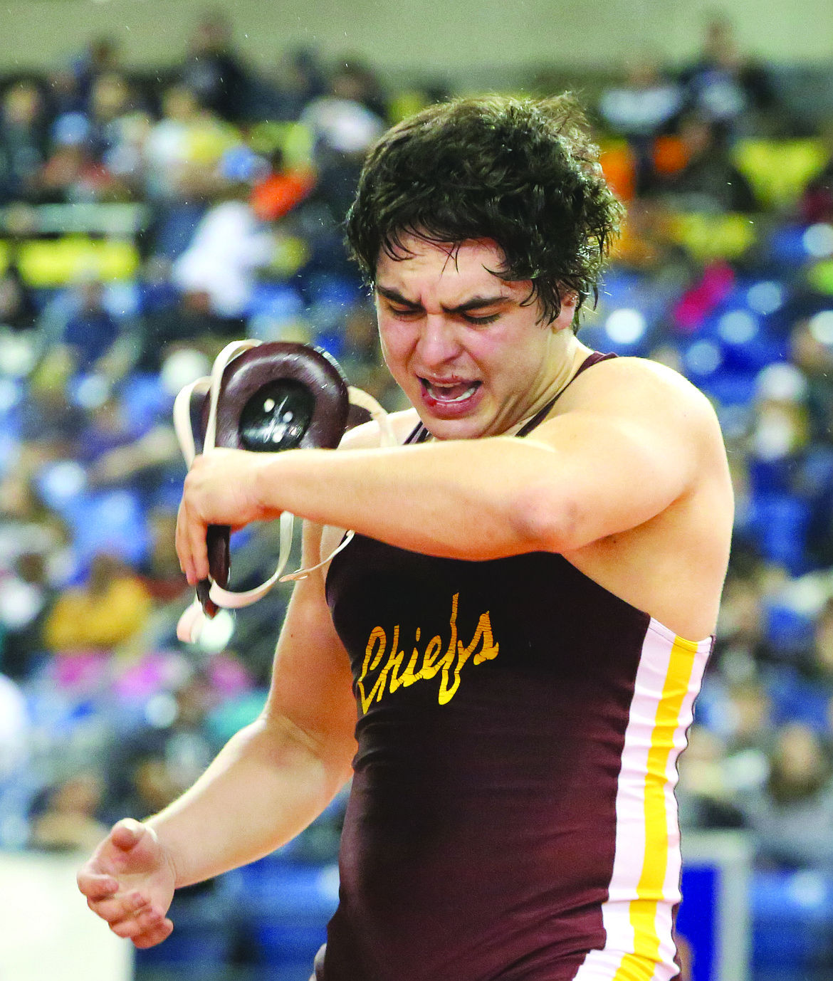 Connor Vanderweyst/Columbia Basin HeraldMoses Lake's Bailey Sanchez removes his headgear after defeating Pasco's Dominick Almaguer at Mat Classic XXX.