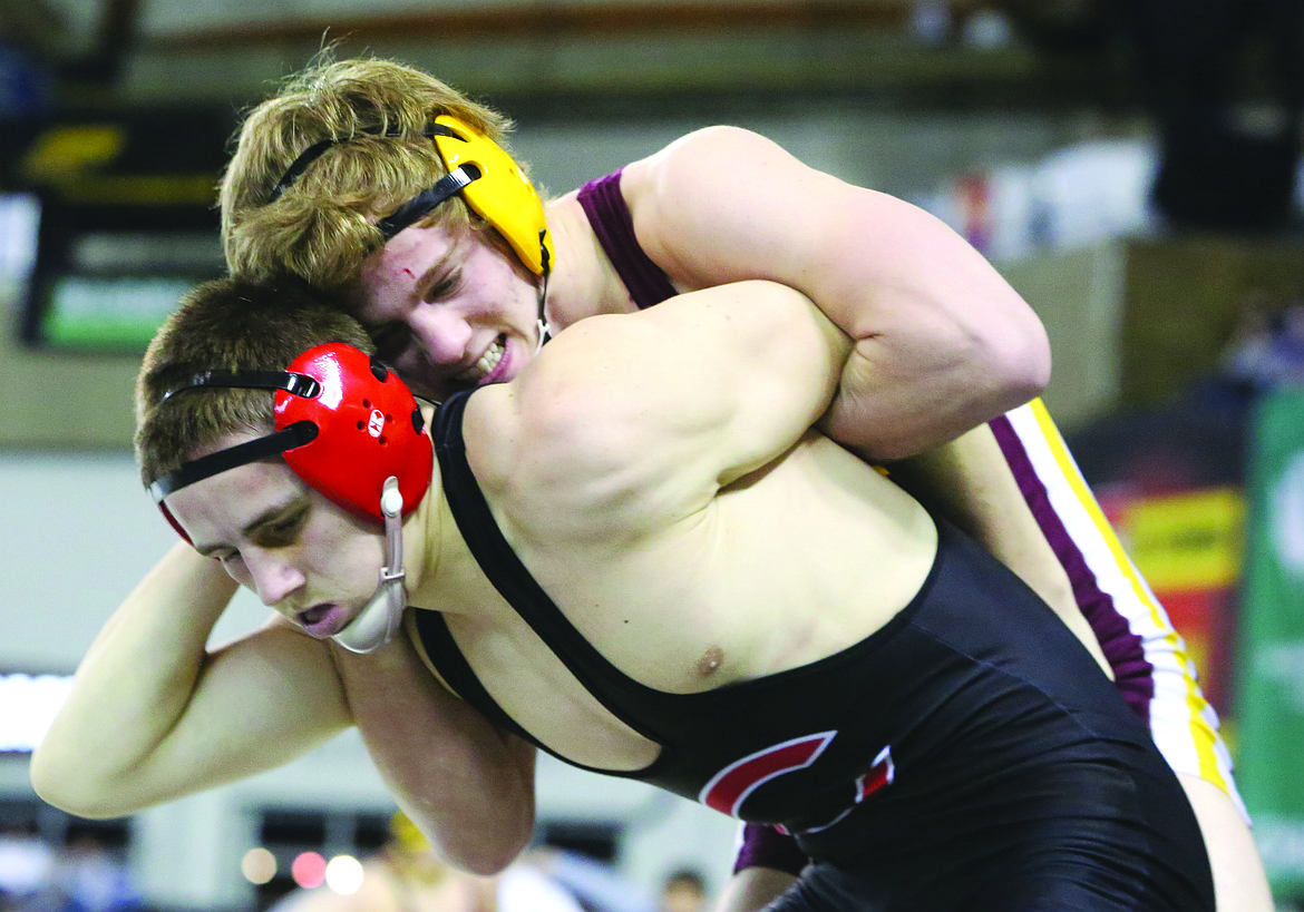 Connor Vanderweyst/Columbia Basin HeraldMoses Lake's Hunter Cruz (maroon) tries to keep Camas' Gideon Malychewski from escaping during the 160-pound semifinals at Mat Classic XXX.