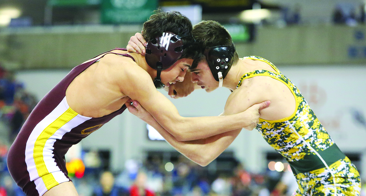 Connor Vanderweyst/Columbia Basin HeraldMoses Lake Jonathan Tanguma (left) goes head-to-head with Kentridge's William Sirbu for seventh/eighth place at Mat Classic XXX.