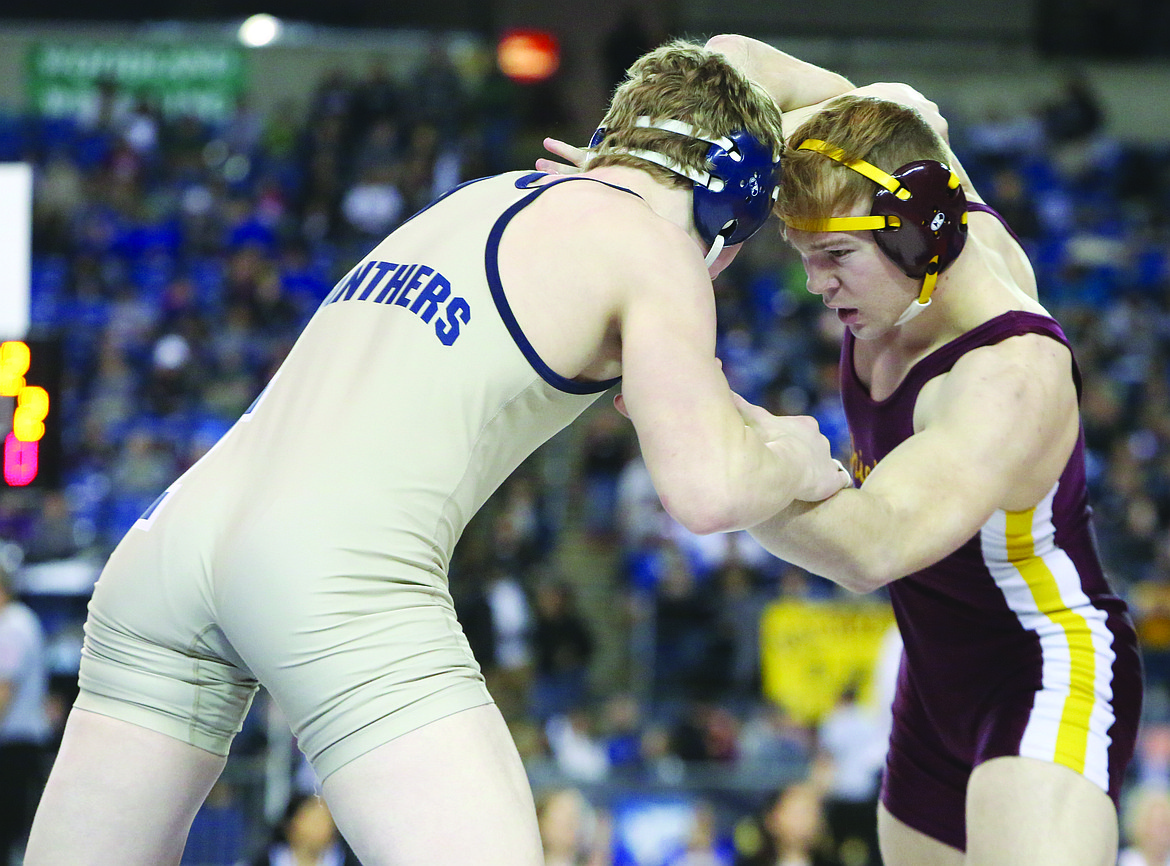 Connor Vanderweyst/Columbia Basin HeraldMoses Lake's Beau Mauseth gets tied up with Mead's Ben Voightleander during the fifth/sixth match at Mat Classic XXX.