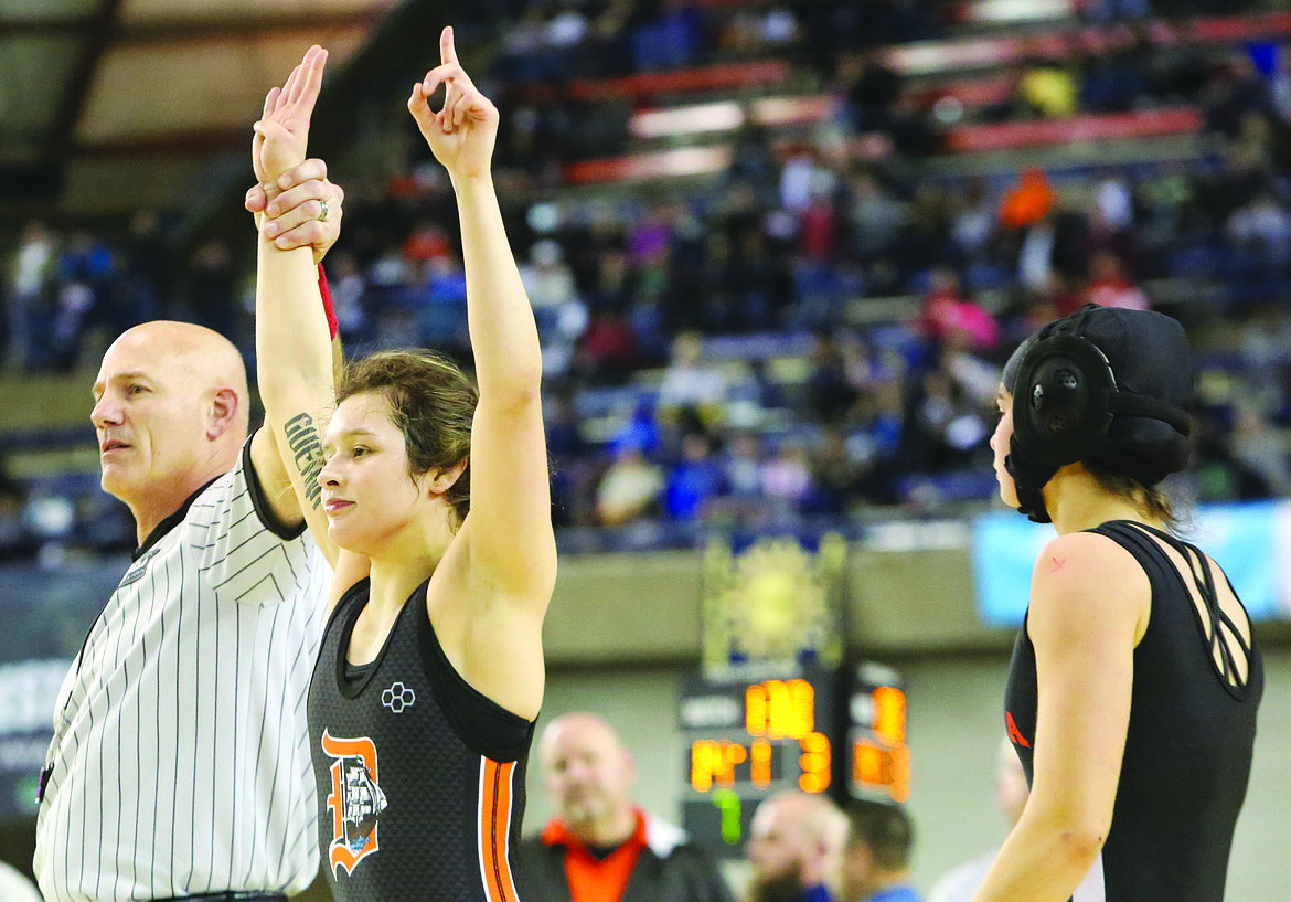 Connor Vanderweyst/Columbia Basin HeraldDavis' Cameron Guerin (center) defeated Ephrata's Mya Spencer 14-0 for the 125-pound state championship, her fourth. Guerin finished her high school career undefeated.