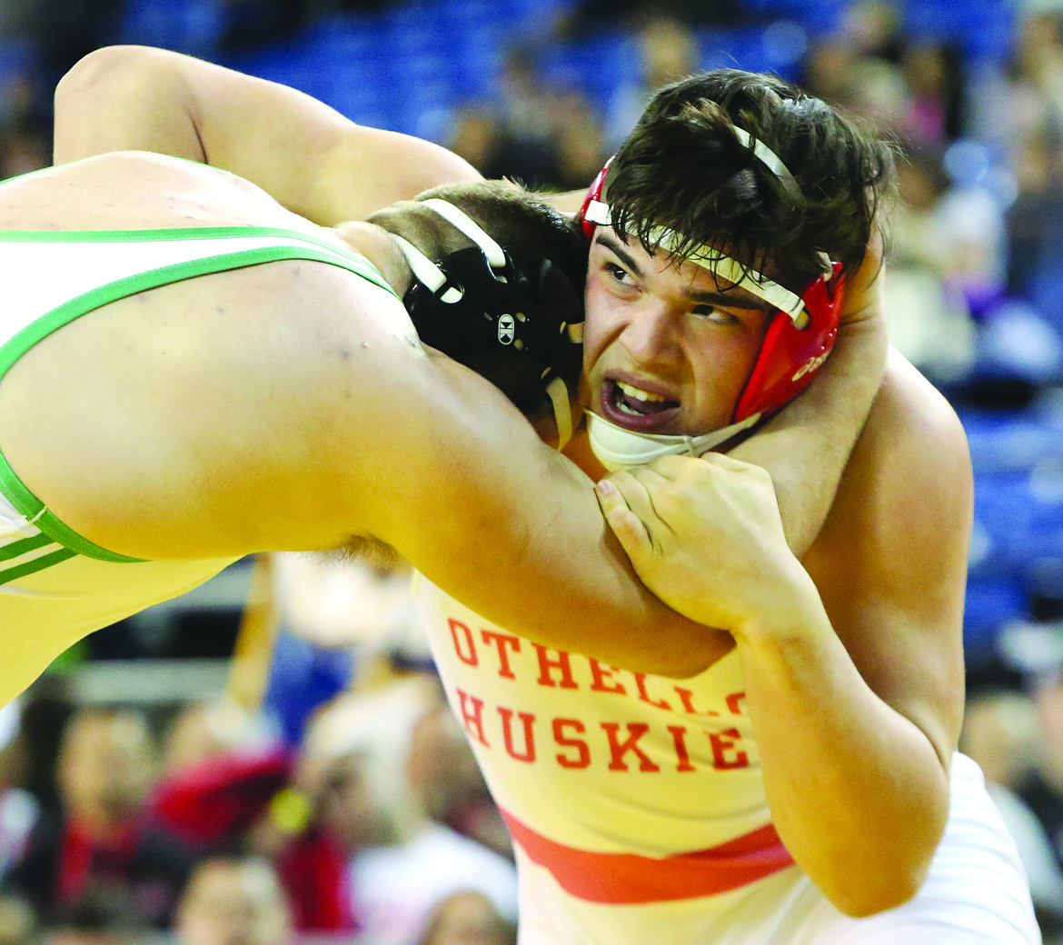 Connor Vanderweyst/Columbia Basin HeraldOthello's Isaiah Perez (right) gets tied up with Tumwater's Cy Hicks during the 285-pound championship at Mat Classic XXX.