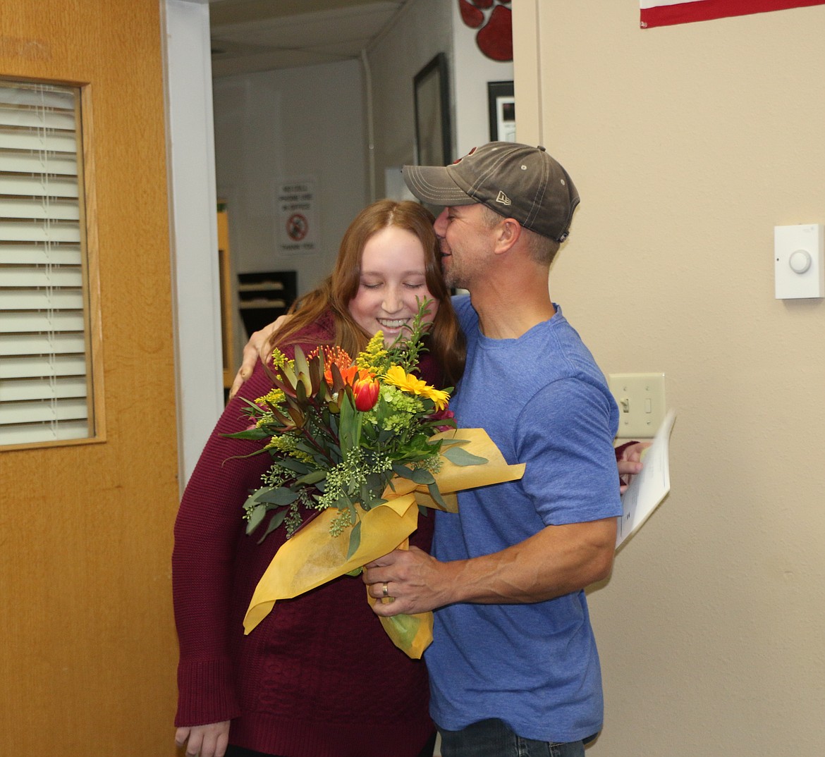 (Photo by CAROLINE LOBSINGER)
Sandpoint High School senior Cienna Roget, left, is embraced by her father, Andy Roget, on Monday after learning she is a finalist in the 2018 National Merit Scholarship Program.