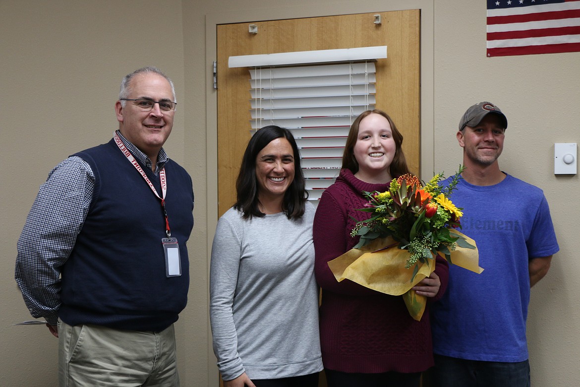 (Photo by CAROLINE LOBSINGER)
Sandpoint High School senior Cienna Roget, second from right, is joined by SHS Principal Tom Albertson, left, and her parents, Andy and Mindy Roget, on Monday after learning she was named a finalist in the 2018 National Merit Scholarship Program.