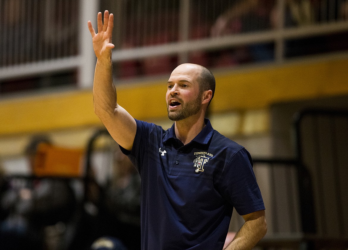 Timberlake girls basketball coach Matt Miller calls out a play to his team during the 3A District 1 championship game Wednesday night at North Idaho College.