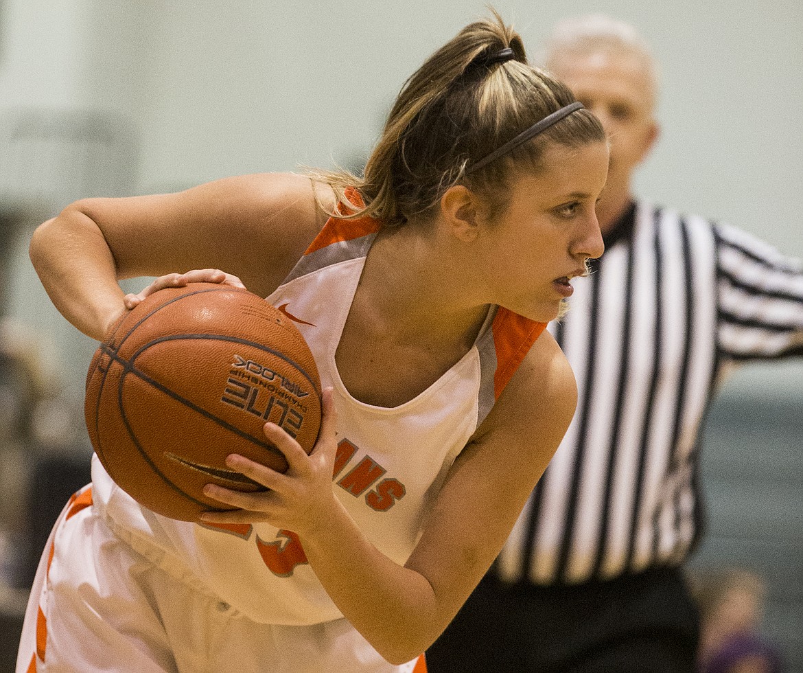 Post Falls guard Shaye Schreibeis stops to scan the Lewiston defense during Tuesday night&#146;s 5A Region 1 championship game at Post Falls High School.