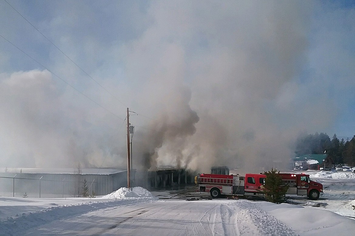 Firefighters respond to a structure fire at a storage-unit building in Marion off U.S. 2 West on Tuesday afternoon. (Photo provided)