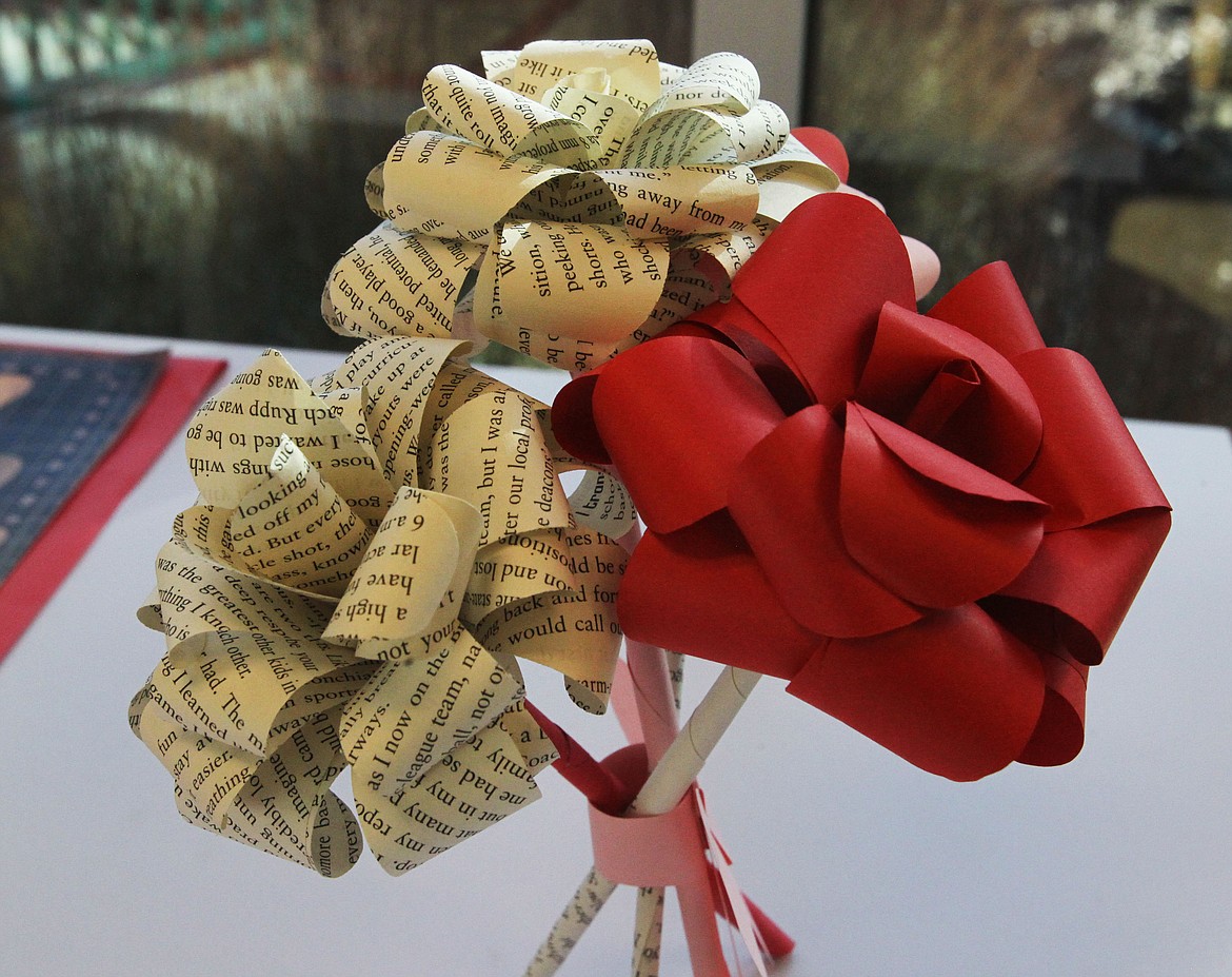 DEVIN WEEKS/Press
These hand-crafted paper roses served as examples for those who attended the Make-It: Valentine Roses event in the Coeur d&#146;Alene Public Library on Saturday. Attendees used construction paper and pages with text to create the perfect paper gift for their Valentines.