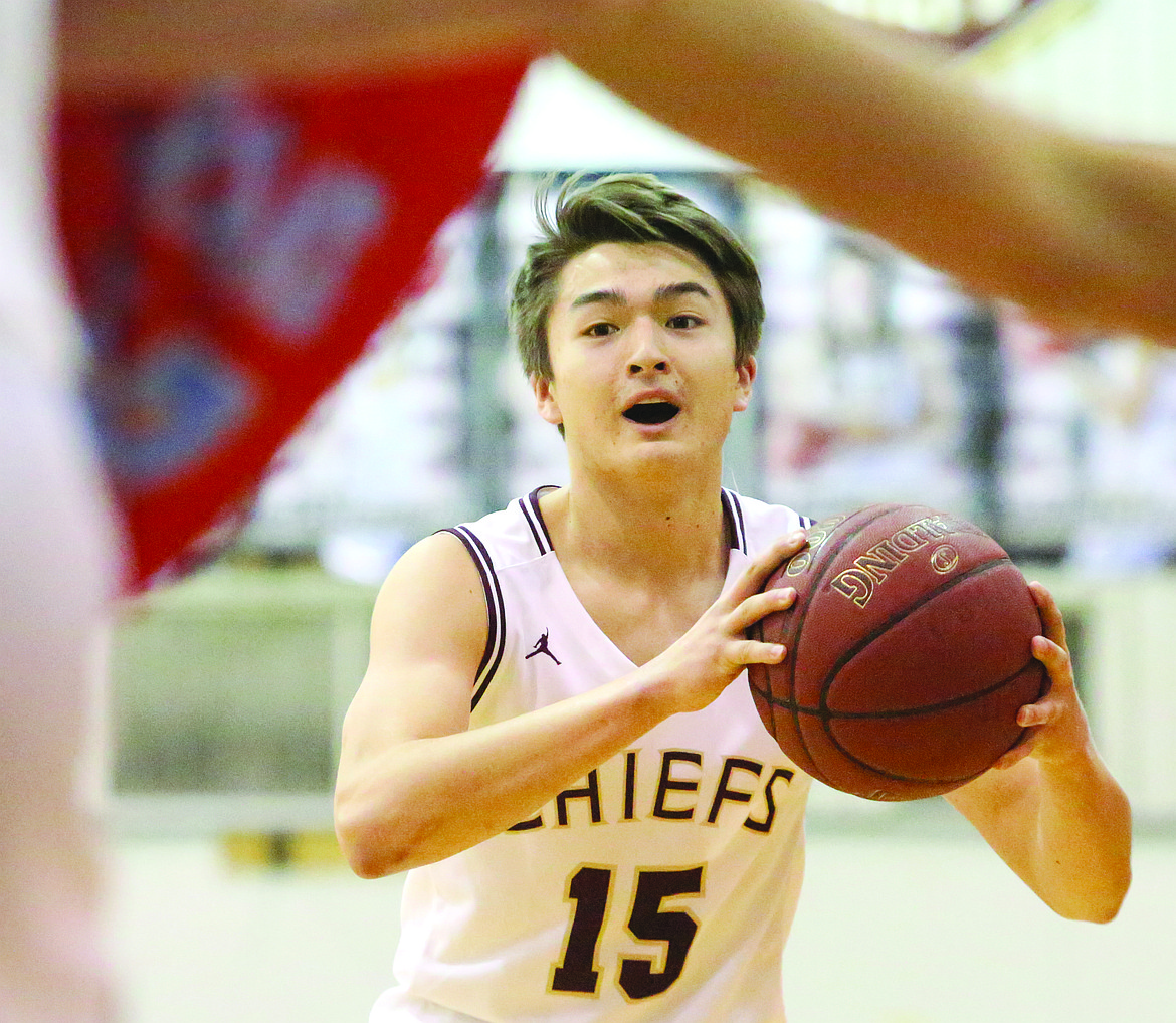 Connor Vanderweyst/Columbia Basin Herald
Moses Lake guard Evan McLean looks to make a pass against West Valley.