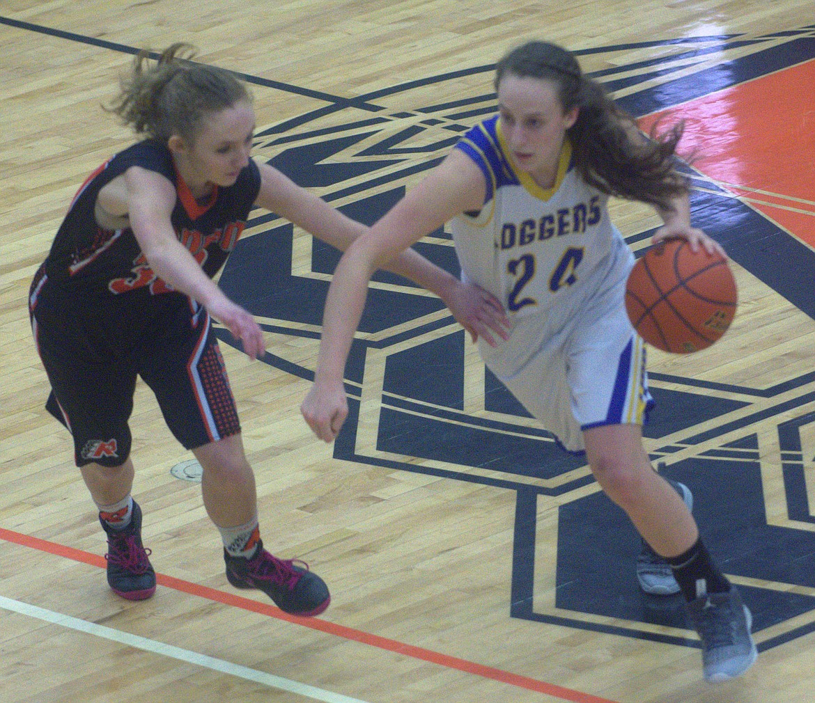Libby junior Jayden Winslow breaks around the Ronan defense during the consolation game of the northwest Class A district tournament in Ronan on Feb. 17. (Jason Blasco/Lake County Leader)