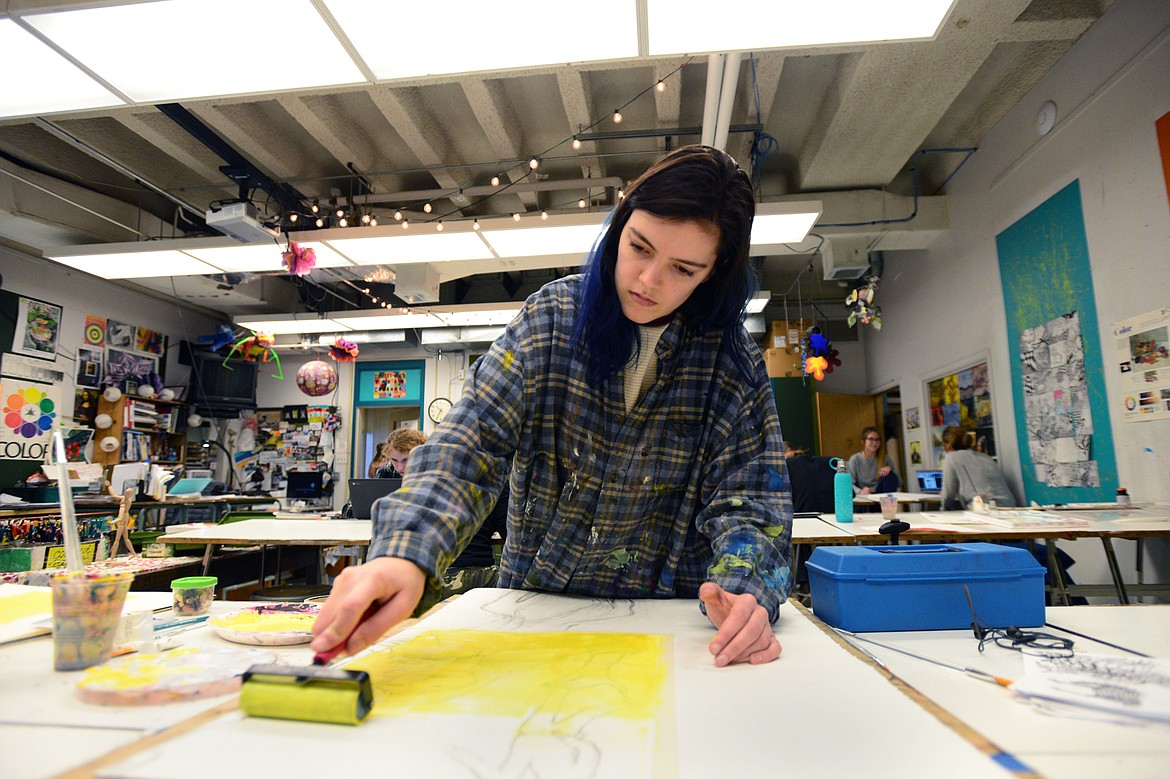 Anna Hedinger, a junior at Flathead High School, works on a new wave movie poster for the 1961 French film &#147;Une femme est une femme&#148; or &#147;A woman is a woman.&#148;