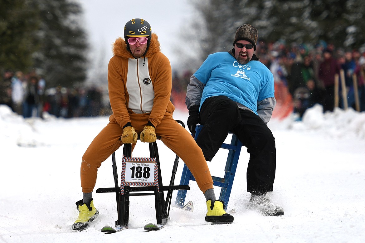 Barstool skiers race down Sugar Hill during Cabin Fever Days in Martin City on Saturday. (Casey Kreider/Daily Inter Lake)