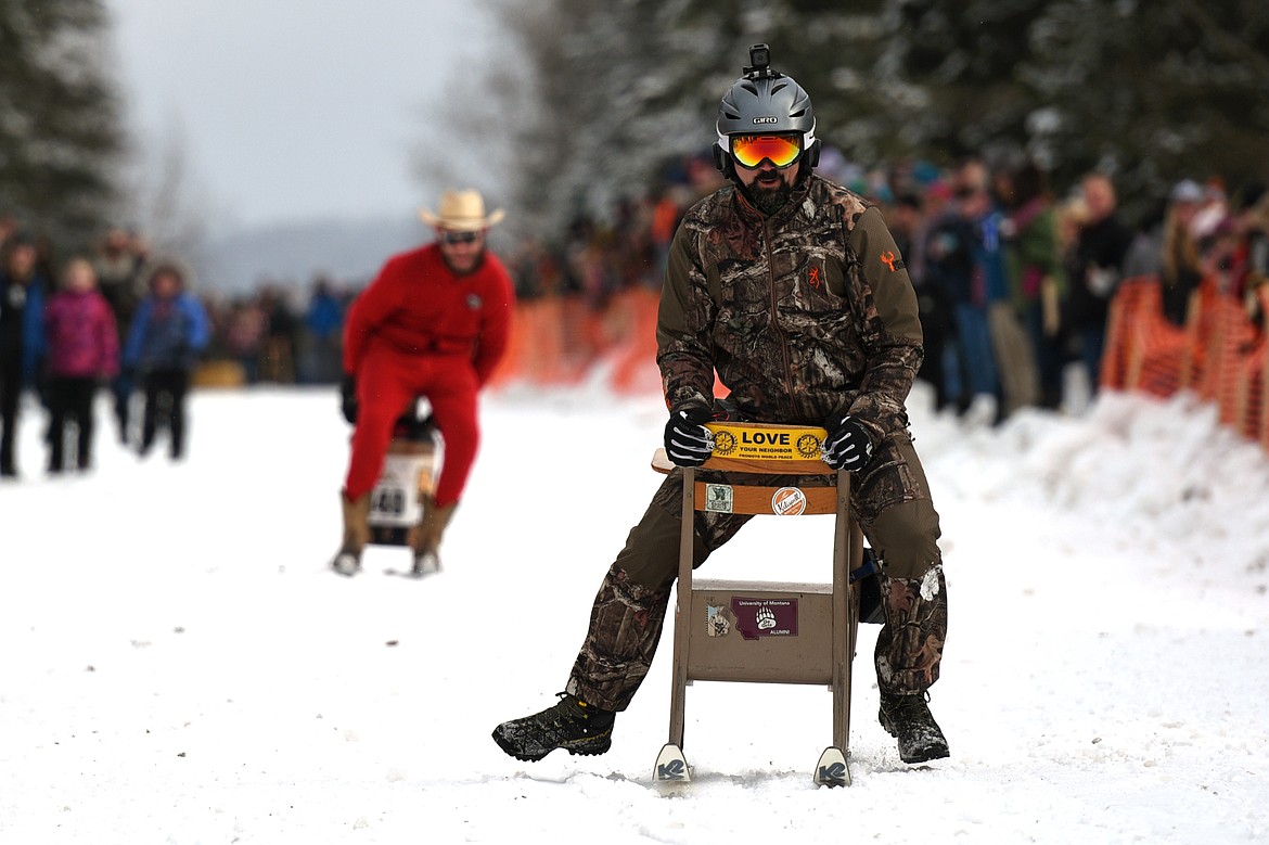 Barstool skiers race down Sugar Hill during Cabin Fever Days in Martin City on Saturday. (Casey Kreider/Daily Inter Lake)