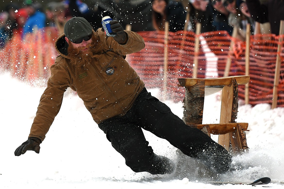 Barstool skiers race down Sugar Hill during Cabin Fever Days in Martin City on Saturday. (Casey Kreider/Daily Inter Lake)