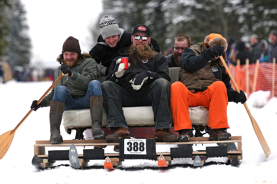 Barstool skiers race down Sugar Hill during Cabin Fever Days in Martin City on Saturday. (Casey Kreider/Daily Inter Lake)