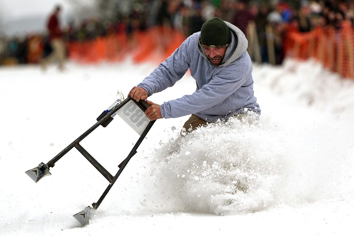 Barstool skiers race down Sugar Hill during Cabin Fever Days in Martin City on Saturday. (Casey Kreider/Daily Inter Lake)