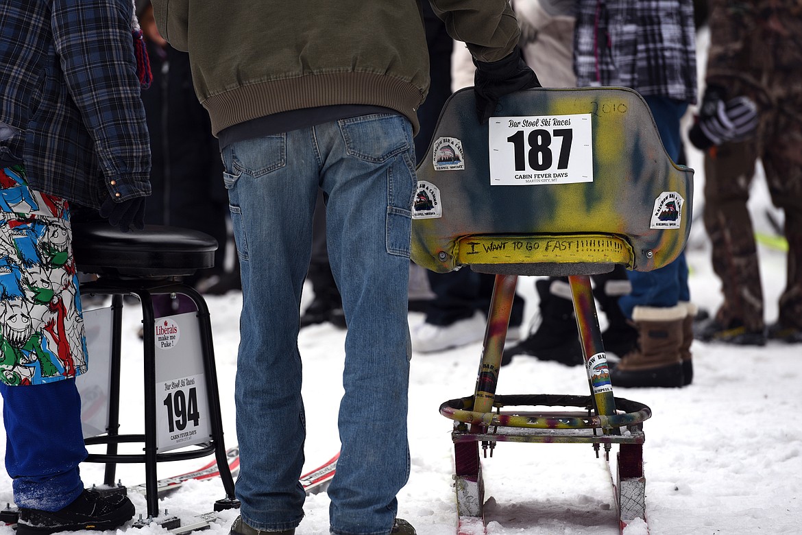 A barstool skier with a message written on the back of his seat during Cabin Fever Days in Martin City on Saturday. (Casey Kreider/Daily Inter Lake)