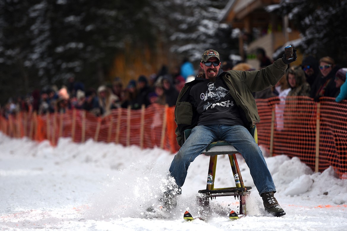 Barstool skiers race down Sugar Hill during Cabin Fever Days in Martin City on Saturday. (Casey Kreider/Daily Inter Lake)