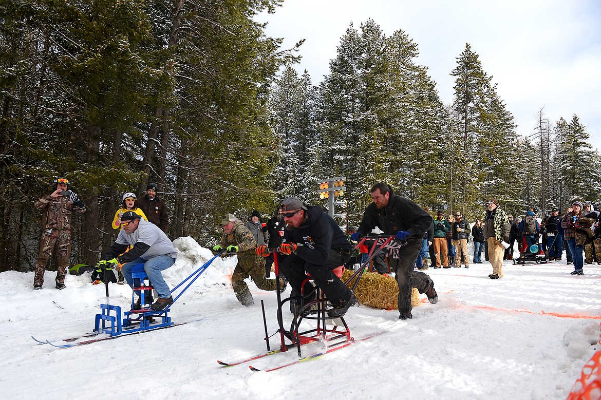 Barstool skiers race down Sugar Hill during Cabin Fever Days in Martin City on Saturday. (Casey Kreider/Daily Inter Lake)