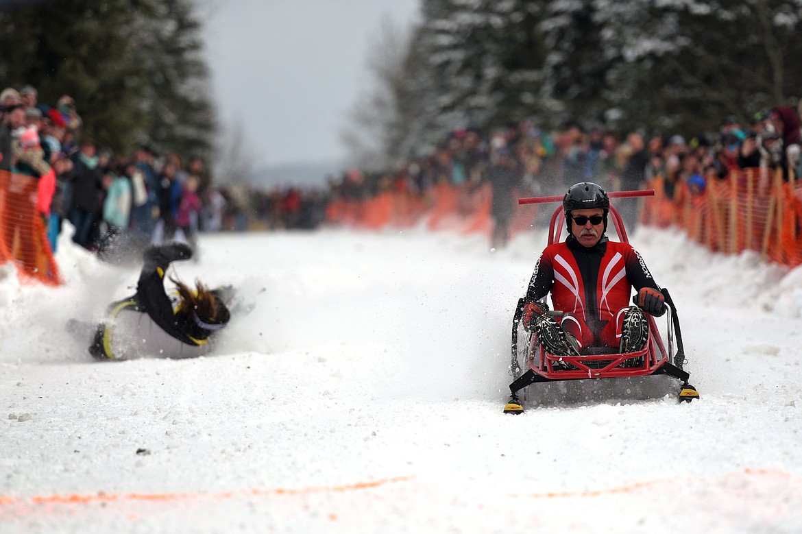 Barstool skiers race down Sugar Hill during Cabin Fever Days in Martin City on Saturday. (Casey Kreider/Daily Inter Lake)