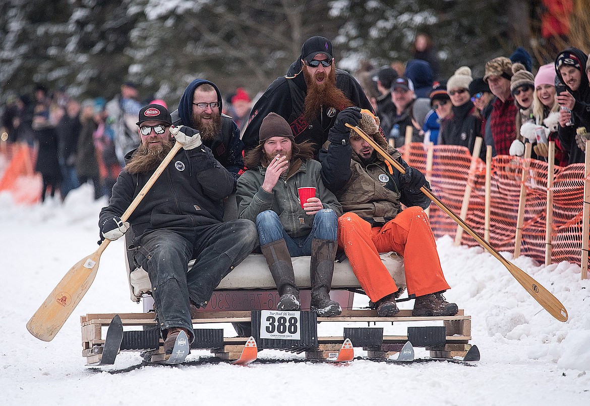 The Sorenson Auto Body sled rows down Sugar Hill.