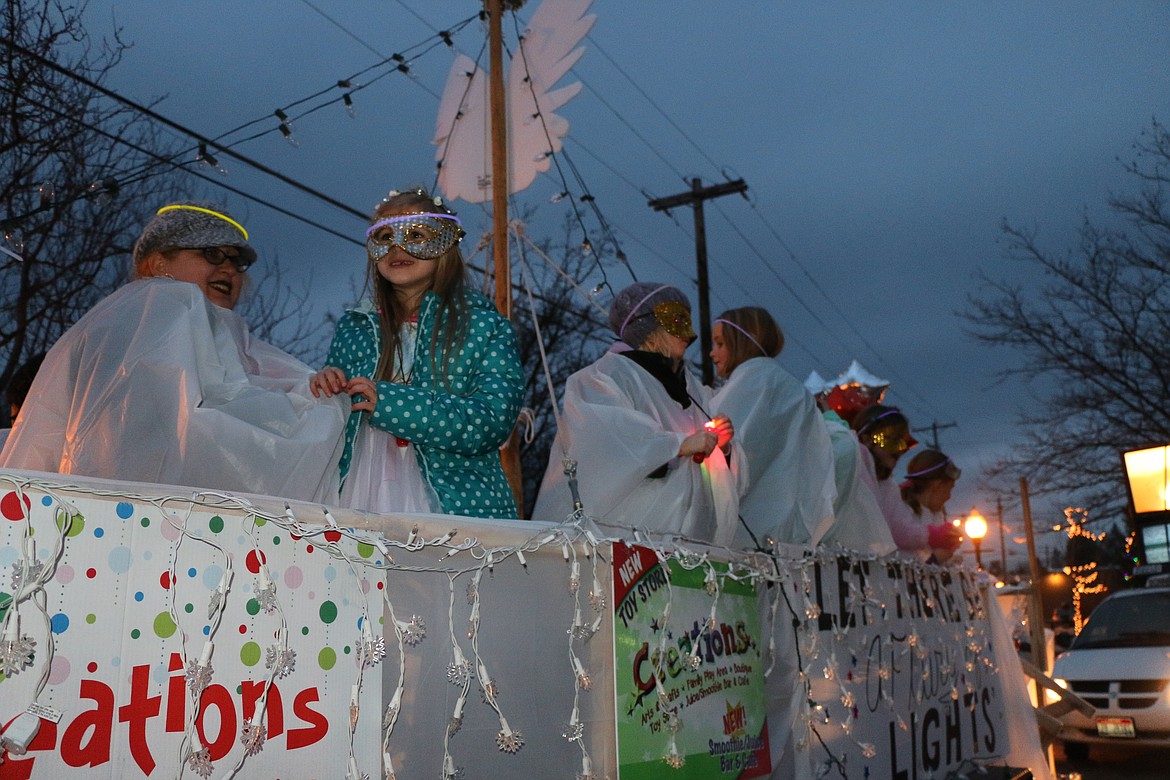 (Daily Bee file photo/CAROLINE LOBSINGER)
Area youngsters take part in the 2016 Winter Carnival Parade of Lights aboard the Creations float. This year&#146;s Winter Carnival kicks off Friday, Feb. 16, with the Parade of Lights, and culminates with the K9 Keg Pull on Sunday, Feb. 25.