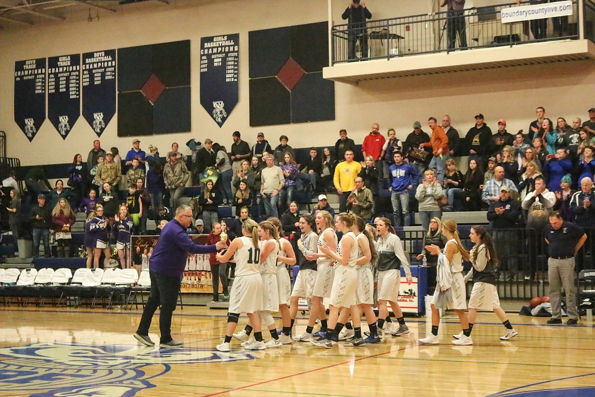 Photos by Mandi Bateman
The Bonners Ferry girls&#146; basketball team celebrates its 46-36 win over Kellogg, which qualified them for the 3A state tournament.