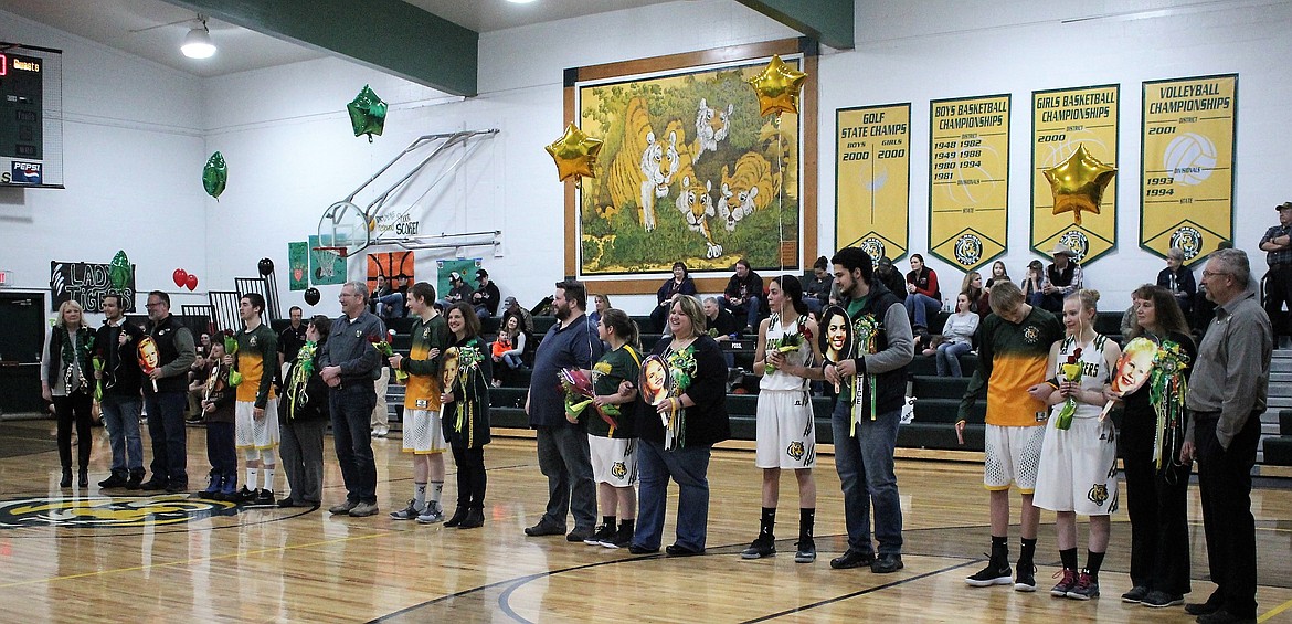 Six Seniors were escorted onto the basketball court by family members in St. Regis on Feb. 8 for Senior Night just before their final home game. (Kathleen Woodford/Mineral Independent).